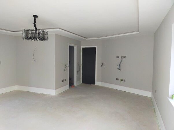 Repainted room with a coved ceiling and grey walls