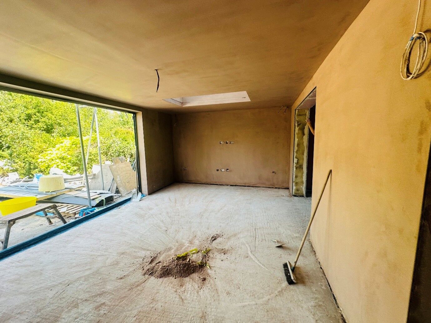Freshly plastered extension walls and ceiling drying out