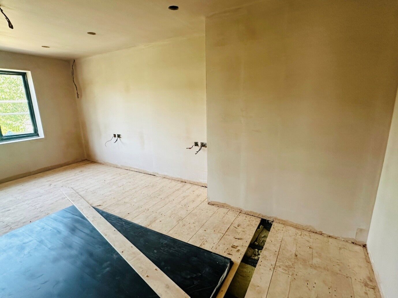 Plastered bedroom walls ready for decorating