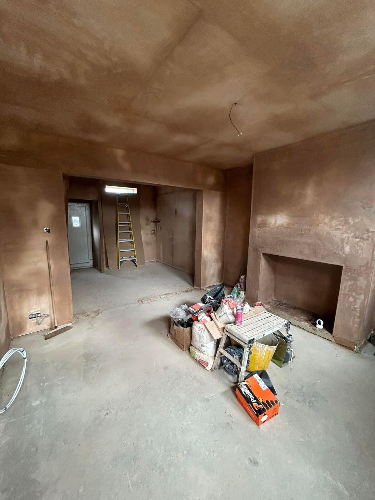 Newly skimmed room with a chimney breast and ceiling in the Wembley property